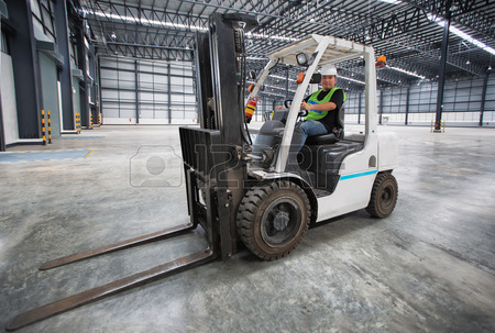 38178478 man driving a forklift through a warehouse in a factory Counterbalance Training