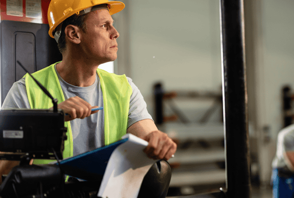 What are the 5 safety rules for forklifts? Forklift operator following the 5 safety rules for forklifts in a busy warehouse